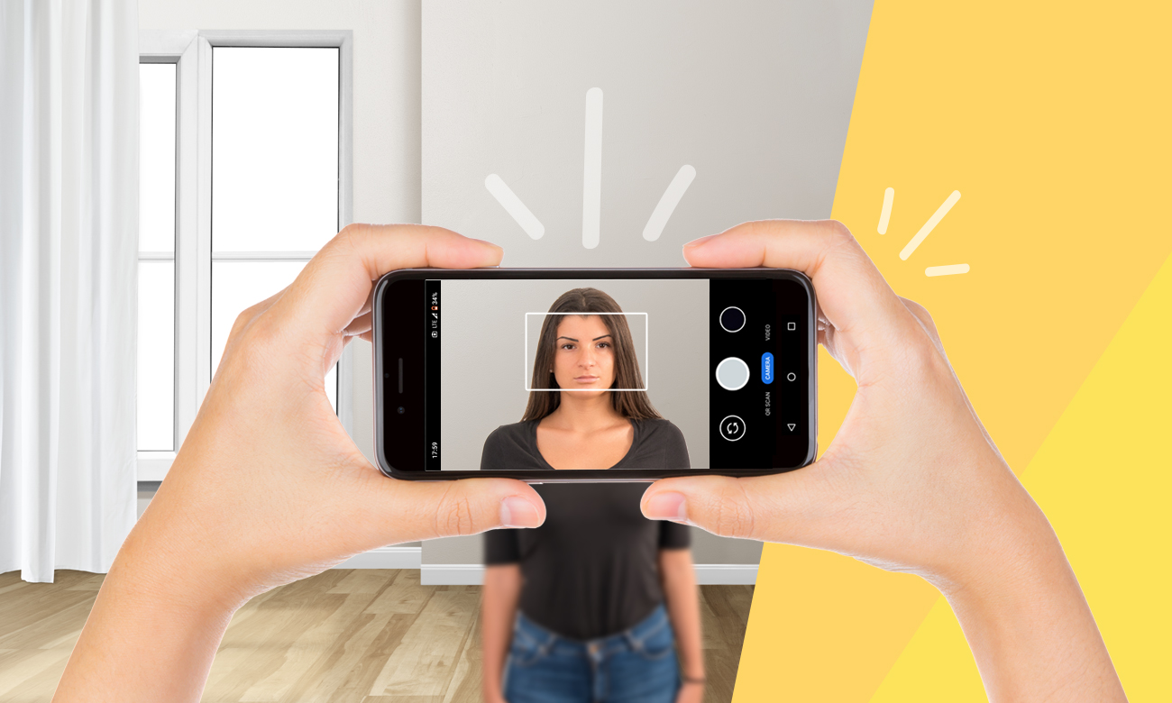 Taking a passport photo at home with a phone or a digital camera.
