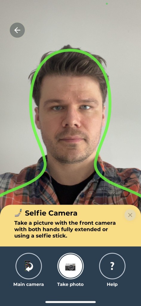 Taking a passport photo with an iPhone—guiding lines helping you frame the face.