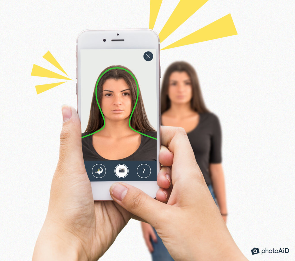 Using PhotoAiD® to take a passport photo with handy guiding lines.