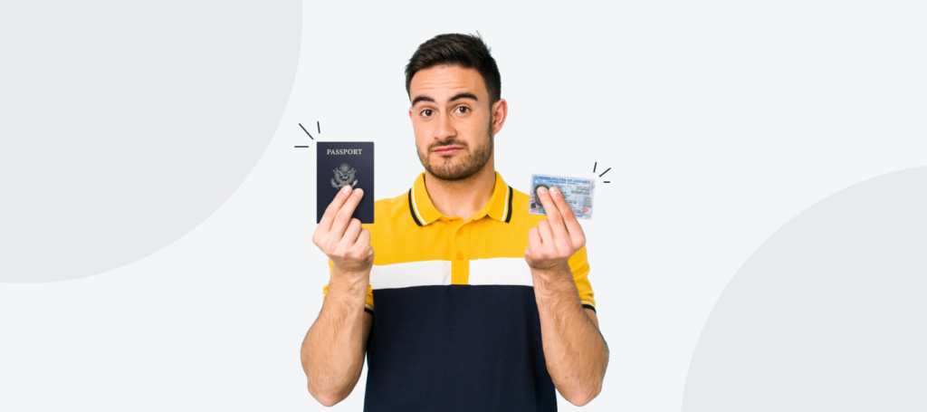 Confused man holding a passport book and a passport card