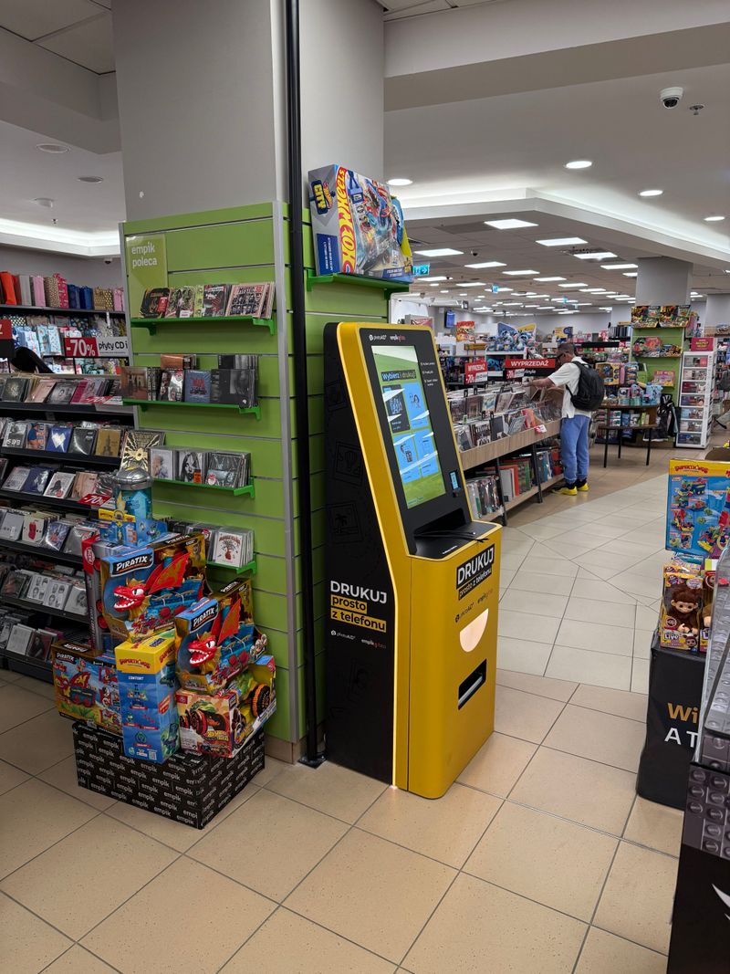 Żółto-czarny foto kiosk PhotoAiD do wydruku zdjęć i dokumentów w Empik Galeria Bałtycka