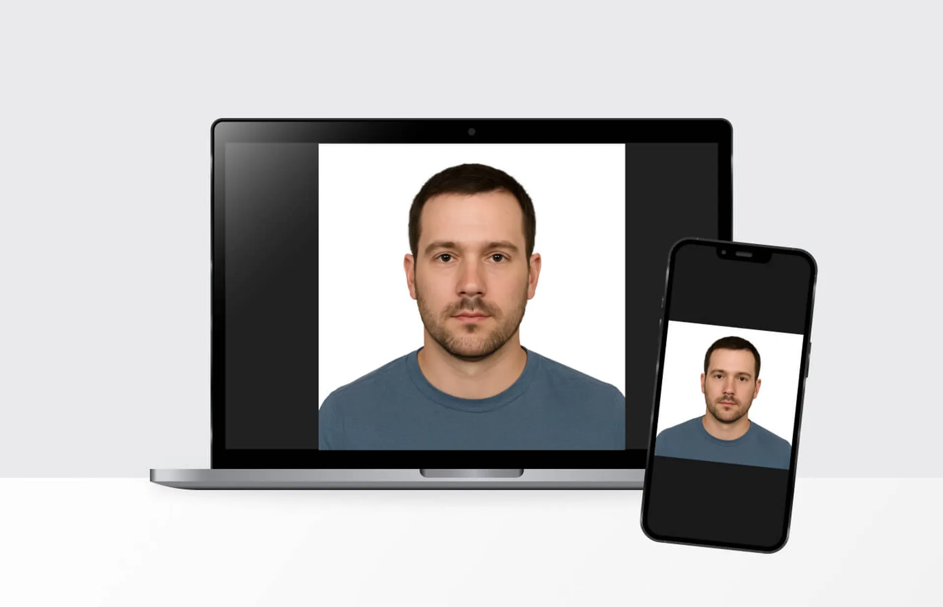 Man’s headshot displayed on a laptop and smartphone screen, illustrating the process of creating an online passport photo using digital tools.