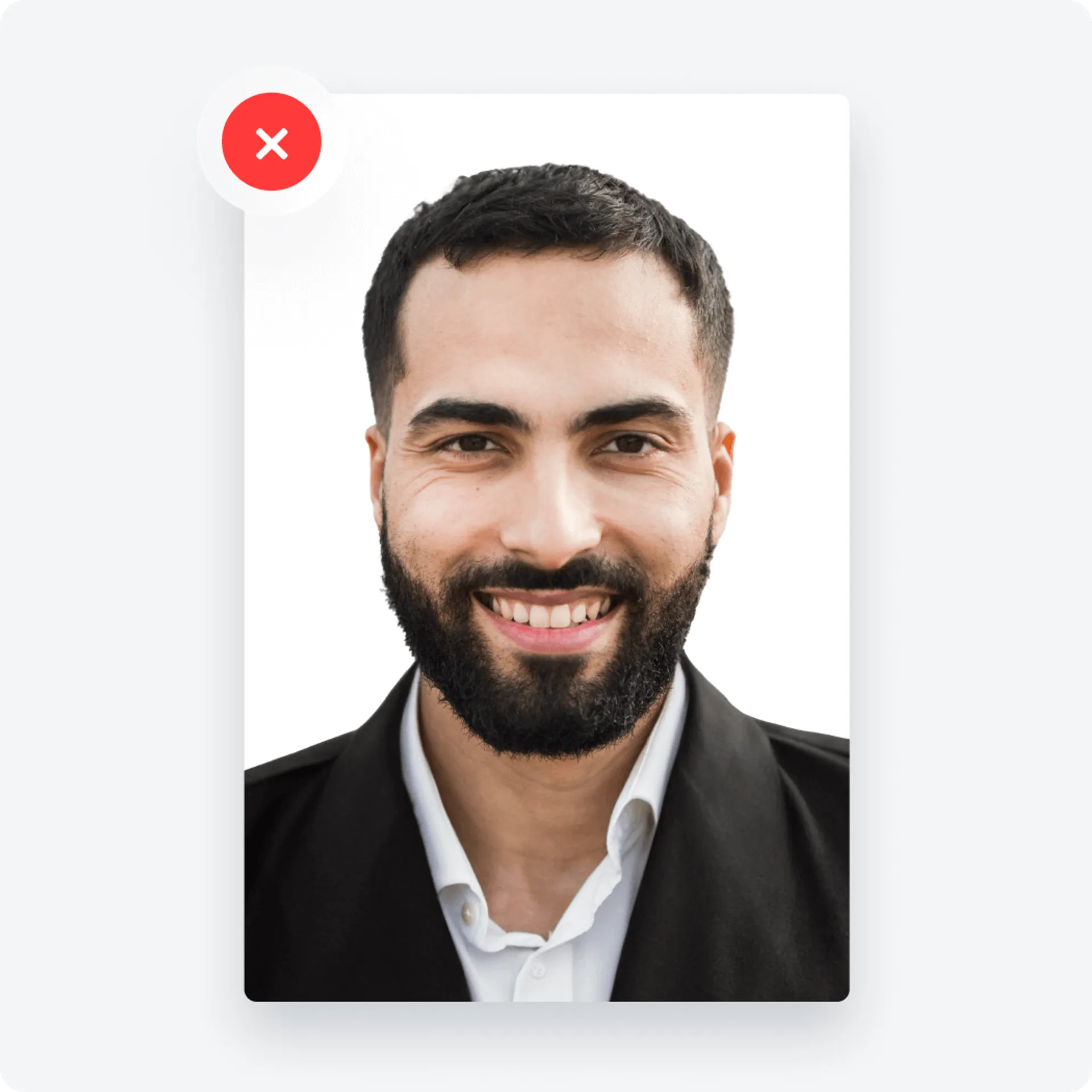 Passport photo with an applicant smiling with the mouth open.